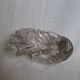 Shell-shaped crystal paperweight.