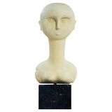 Modernist bust sculpture of a woman in sandstone