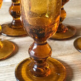 Champagne flutes bubbled amber blown