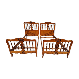 Two solid wooden beds with box springs
