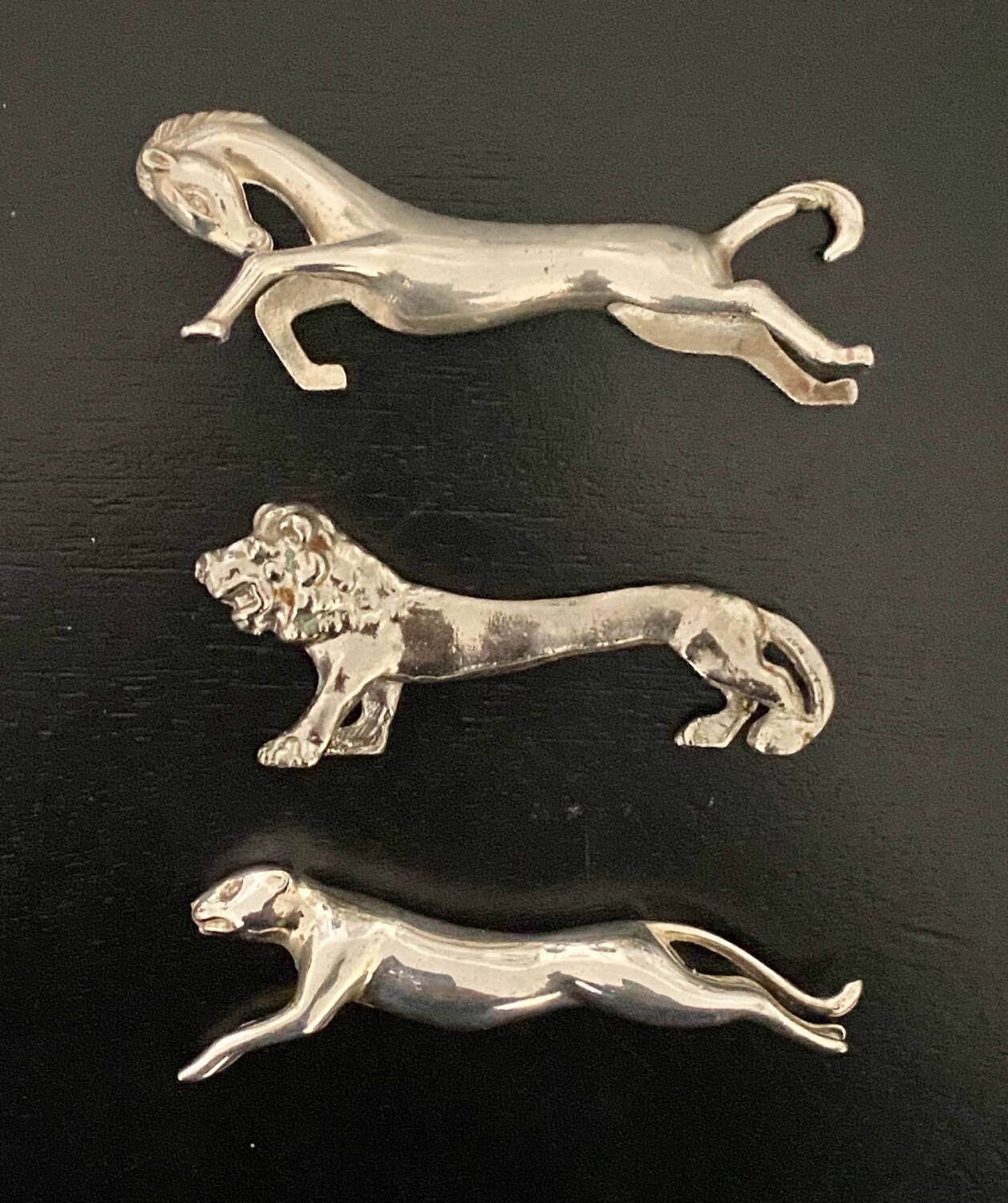 6 various animal shaped knife holders in silver metal
