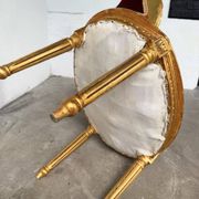 Louis XVI gilt wood and red velvet armchair