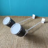 Pair of long white arm wall lights with black spot. "lita device"