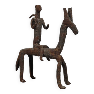 Hand-forged Dogon tribal figurine from naive East Africa.