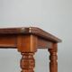 Antique extendable mahogany table with a crank mechanism, United Kingdom.