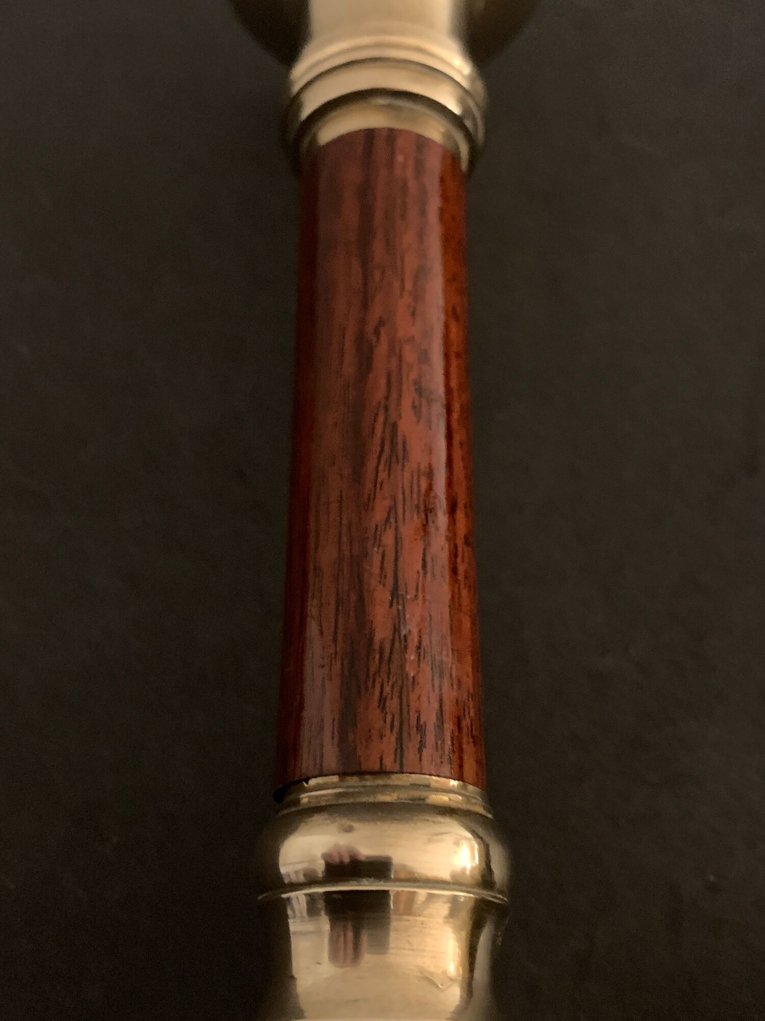 Pair of brass and mahogany wood candle holders