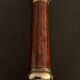 Pair of brass and mahogany wood candle holders