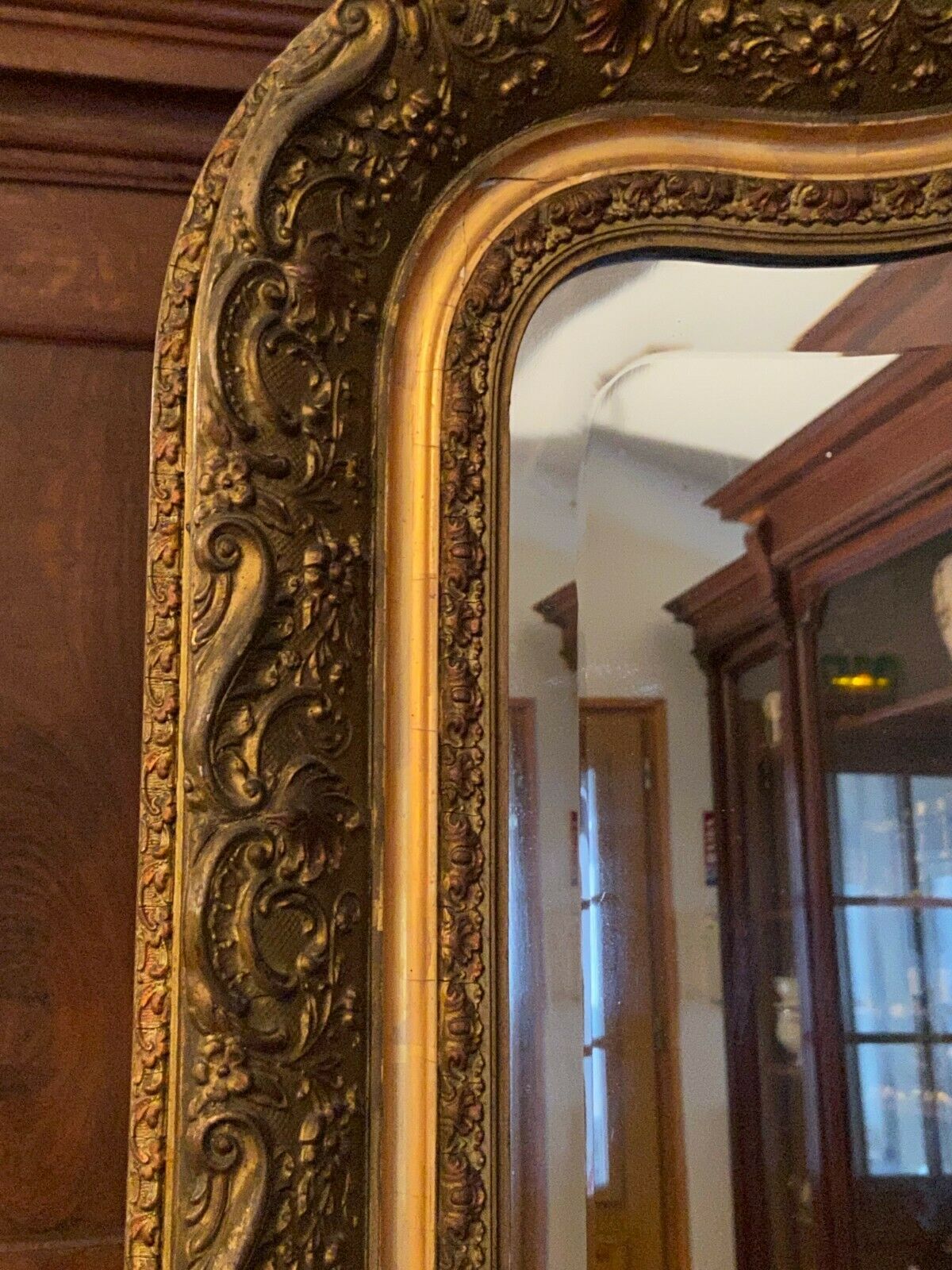 Golden mirror with bevelled ice pediment in Regency style