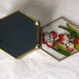 Glass box and hexagonal brass enamelled floral decoration