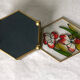 Glass box and hexagonal brass enamelled floral decoration