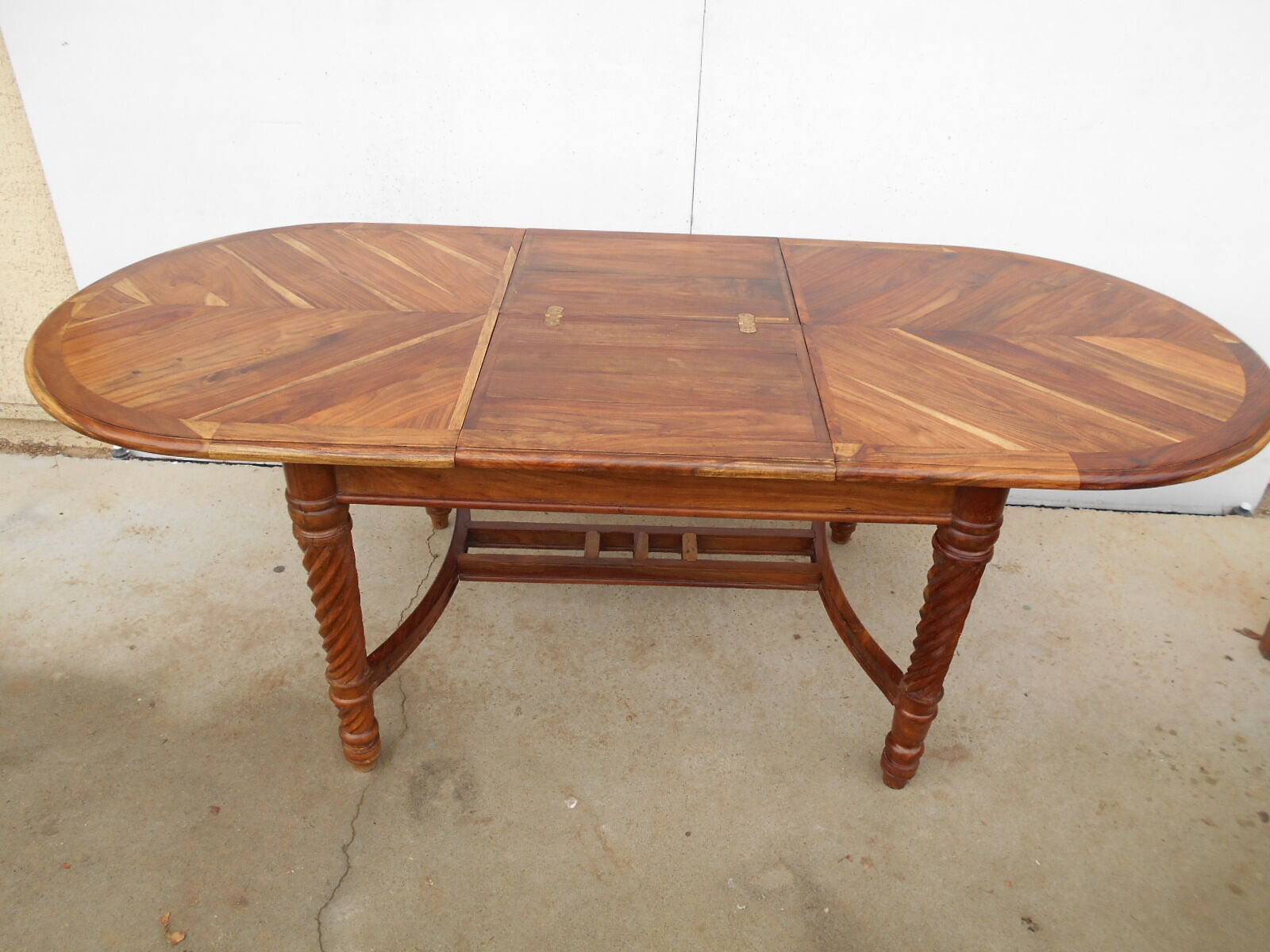 Oval table, integrated extension, in exotic wood