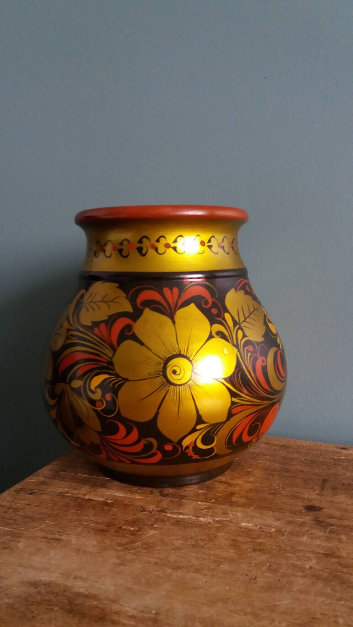 Khokhloma vase, Russian lacquered wood craftsmanship, hand-painted floral decoration.