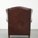 Vintage sheepskin wingback armchair with a timeless English look