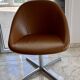 Set of 8 Italian design swivel chairs in cognac leather.