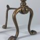 Paire de chenets en laiton au design zoomorphe vintage.