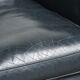 Dark blue club armchair made of cowhide leather with a timeless design