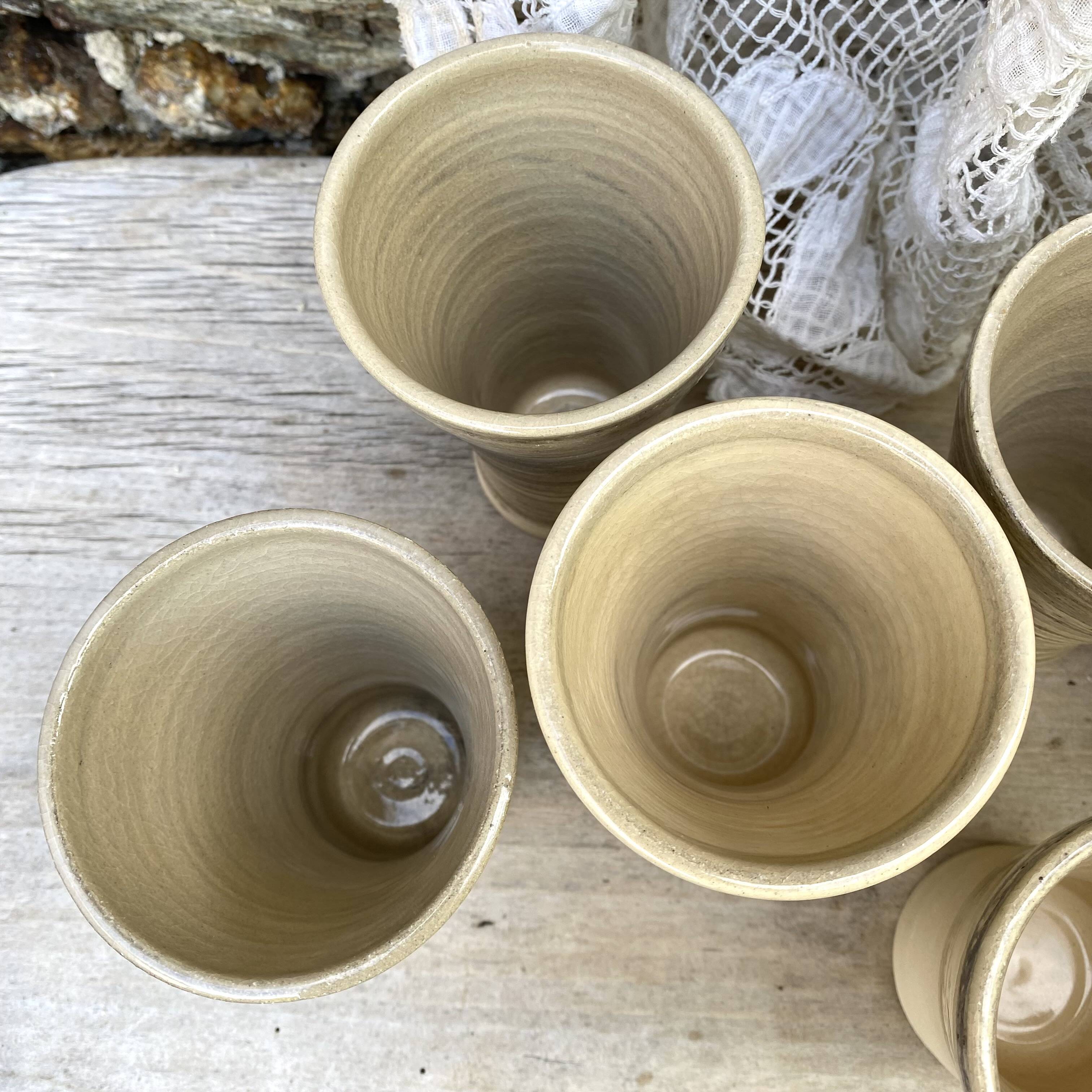 High ceramic cups made of mixed clay.