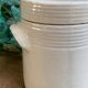 White pot in glazed earth