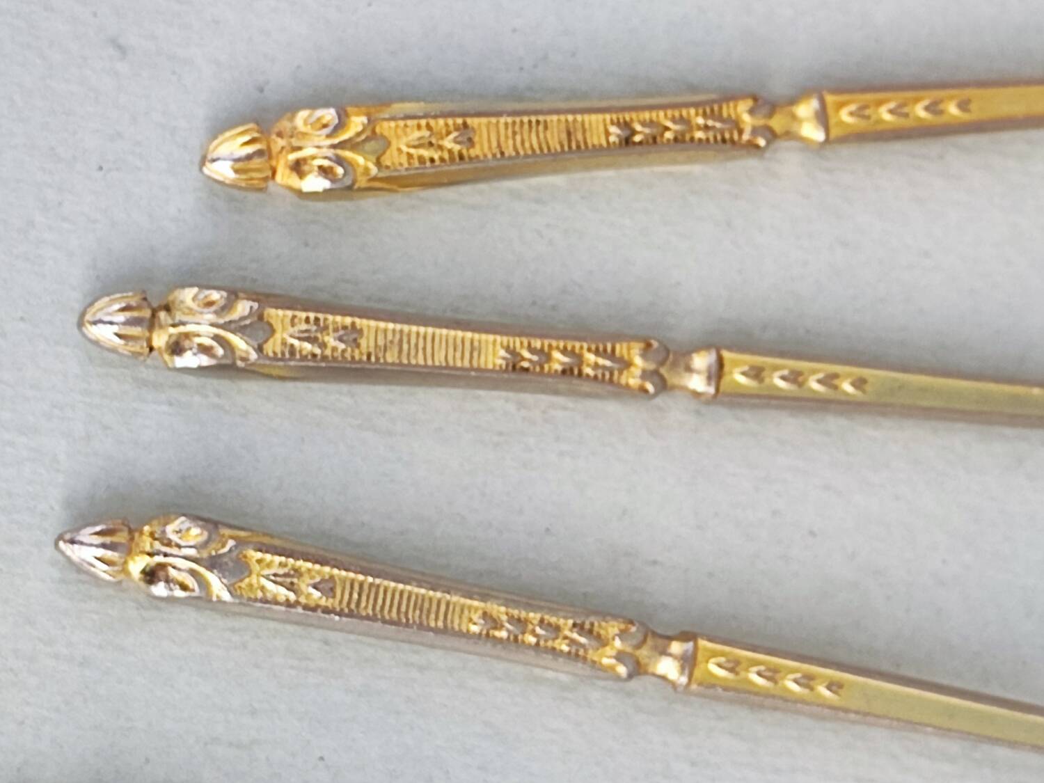 12 gilt metal teaspoons