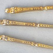 12 gilt metal teaspoons