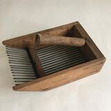 Old comb with berries (blueberries ..) in wood and metal