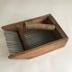 Old comb with berries (blueberries ..) in wood and metal