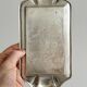 Metal butter dish and thick rectangular glass bowl.