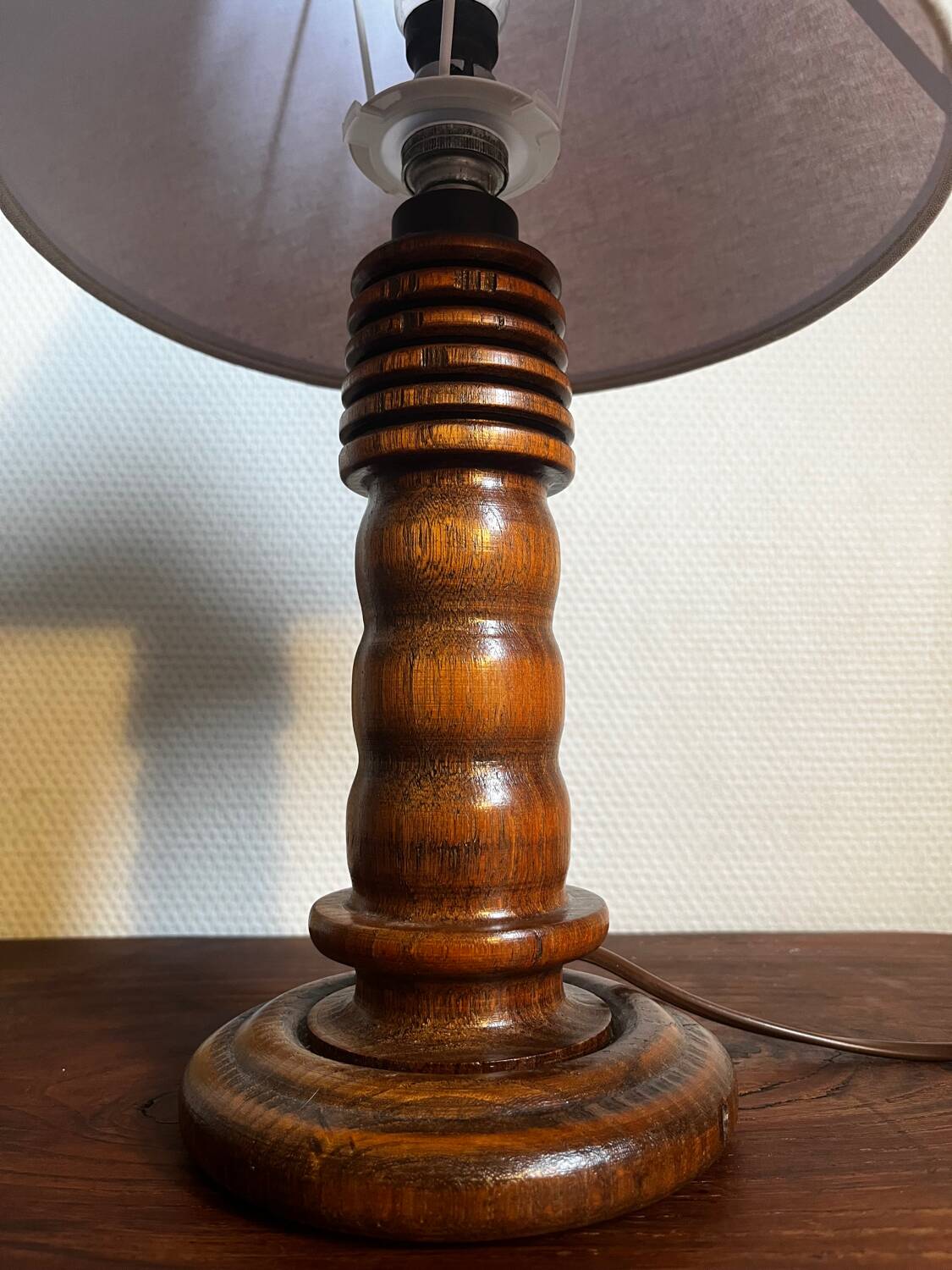 Table lamp with carved wooden base