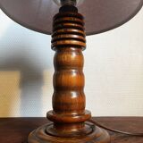 Table lamp with carved wooden base