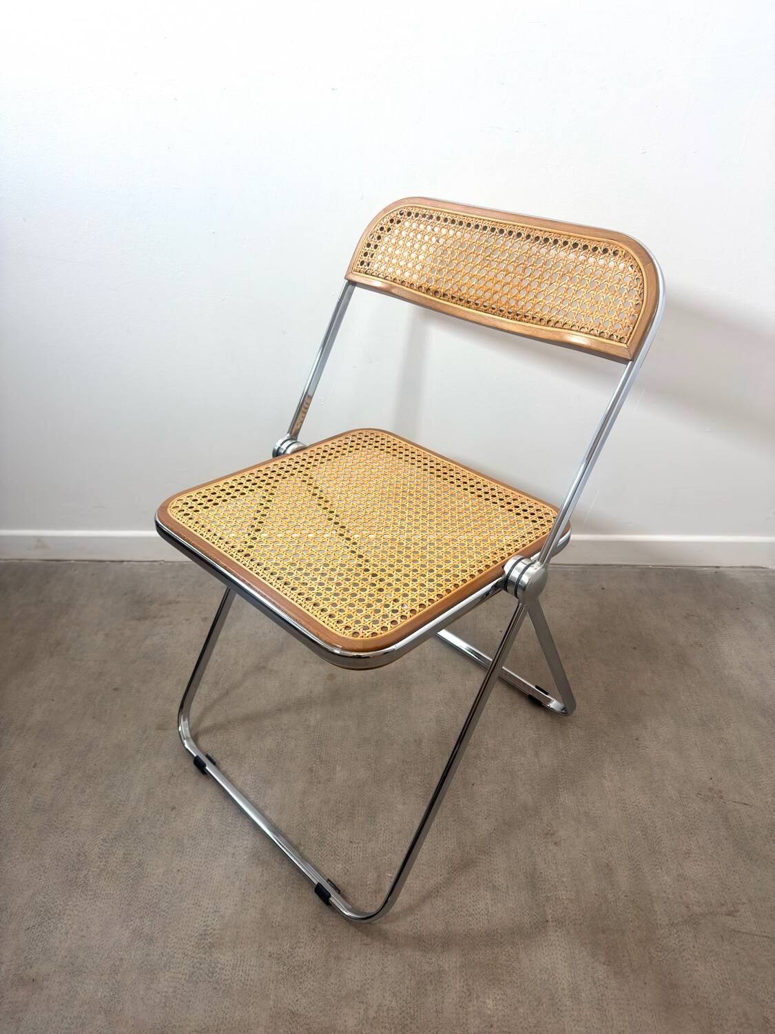 Plia folding chair by Giancarlo Piretti for Castelli – Rattan