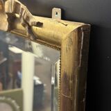 Large mirror with a gold frame