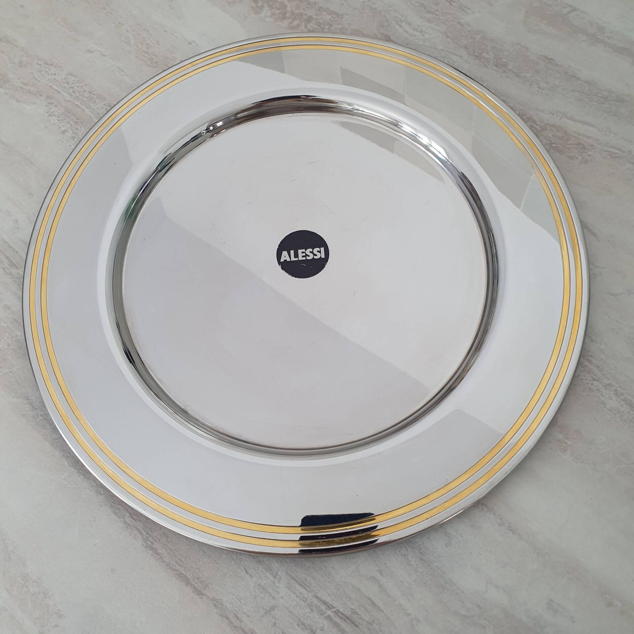 Alessi Ettore Sottsass / Serving plate in stainless steel 18/10 and gold NG5100