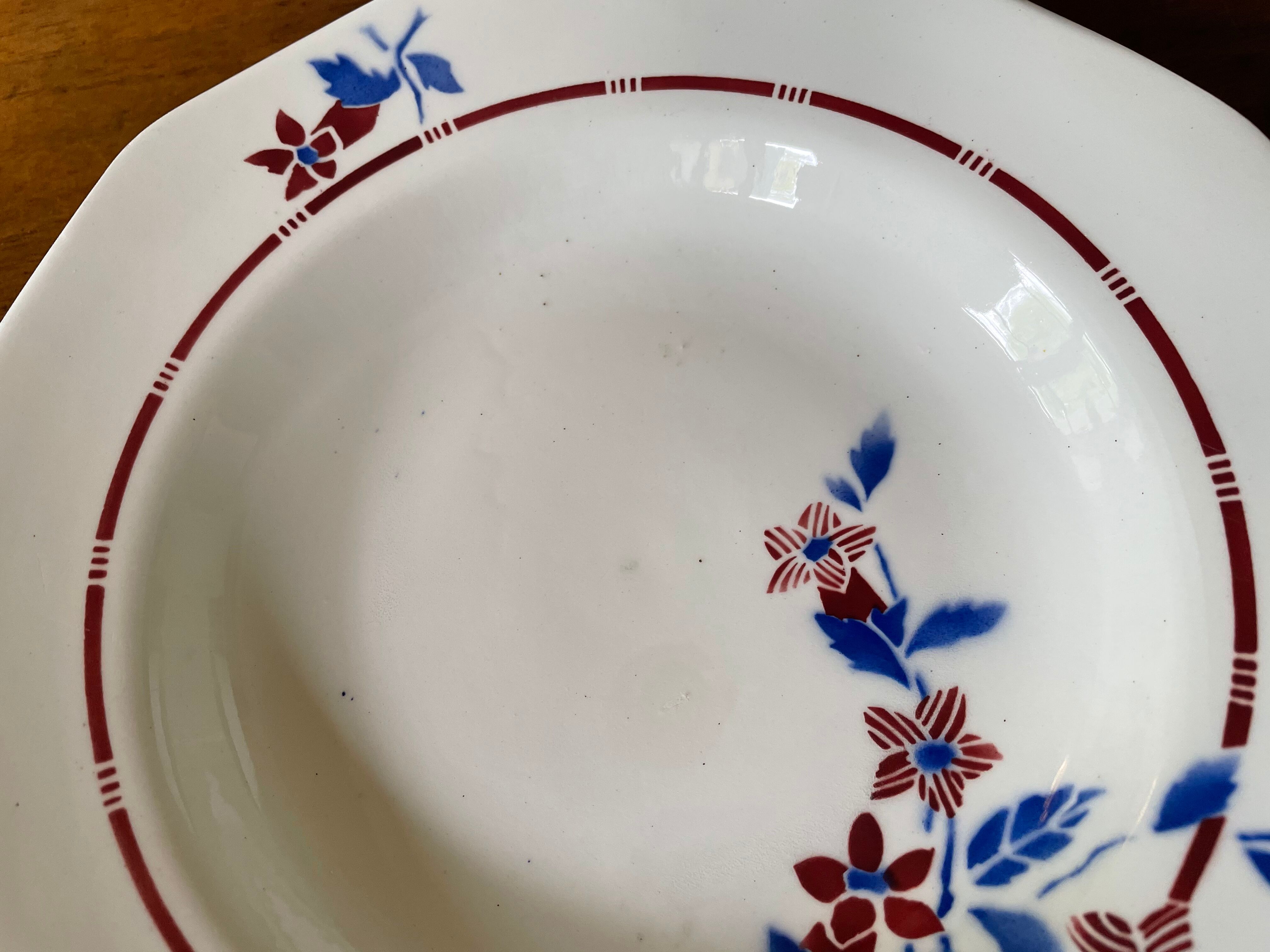 Saint Amand hollow plates decorated with red and blue flowers