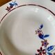 Saint Amand hollow plates decorated with red and blue flowers