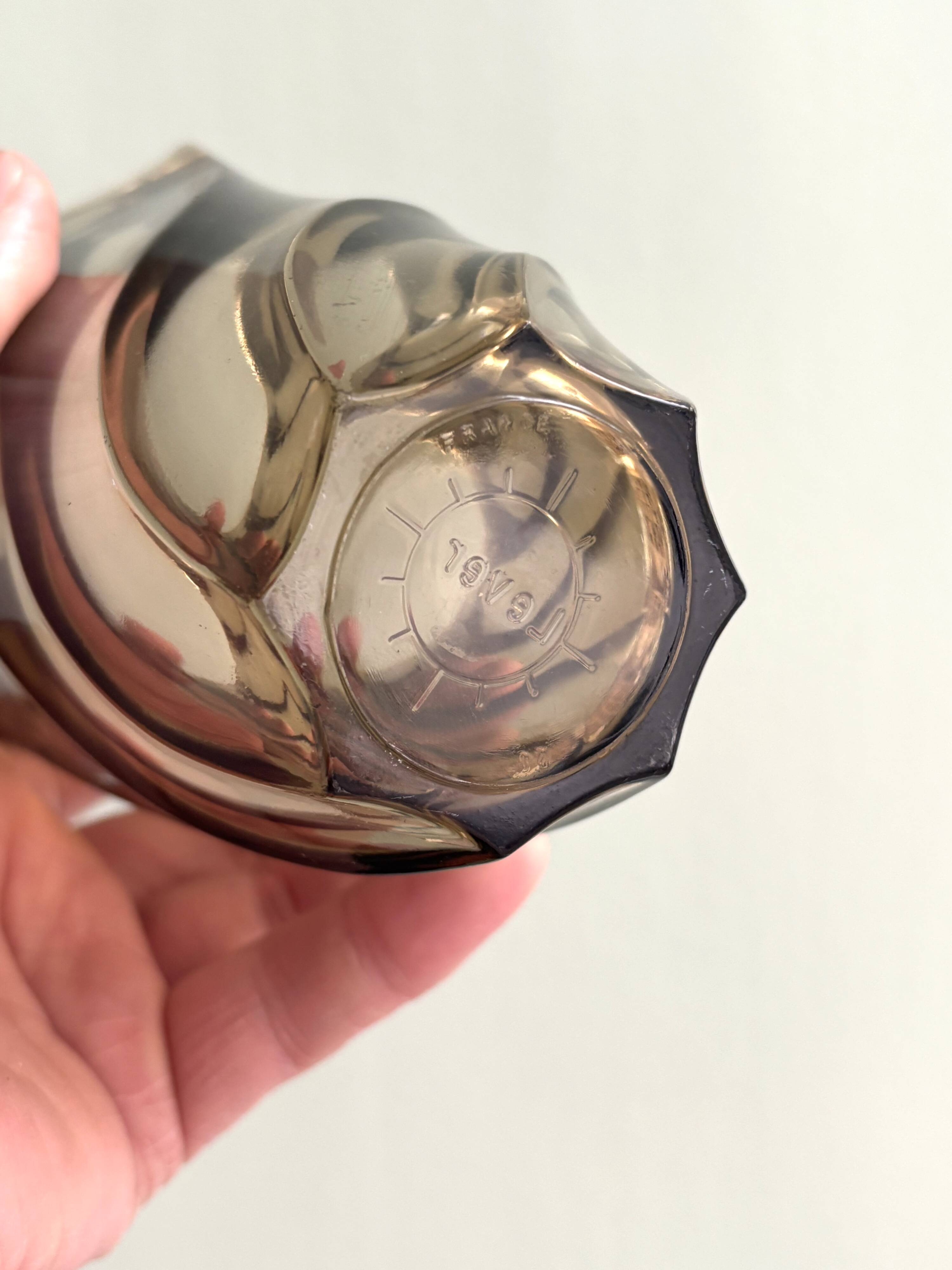 Small translucent dark brown twisted glass vase