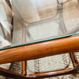 Two rattan and glass bedside tables