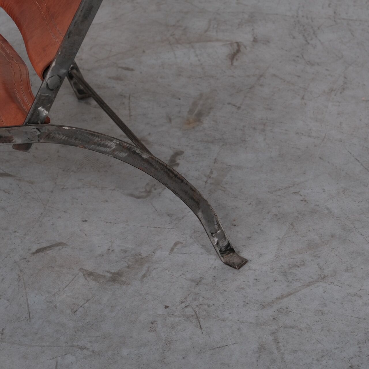 Pair of mid-century leather and metal folding armchairs