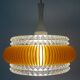 Transparent plastic space age lustre with orange band from the 70s.