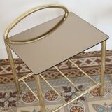 Pair of bedside tables with gold metal and mirrored glass top.
