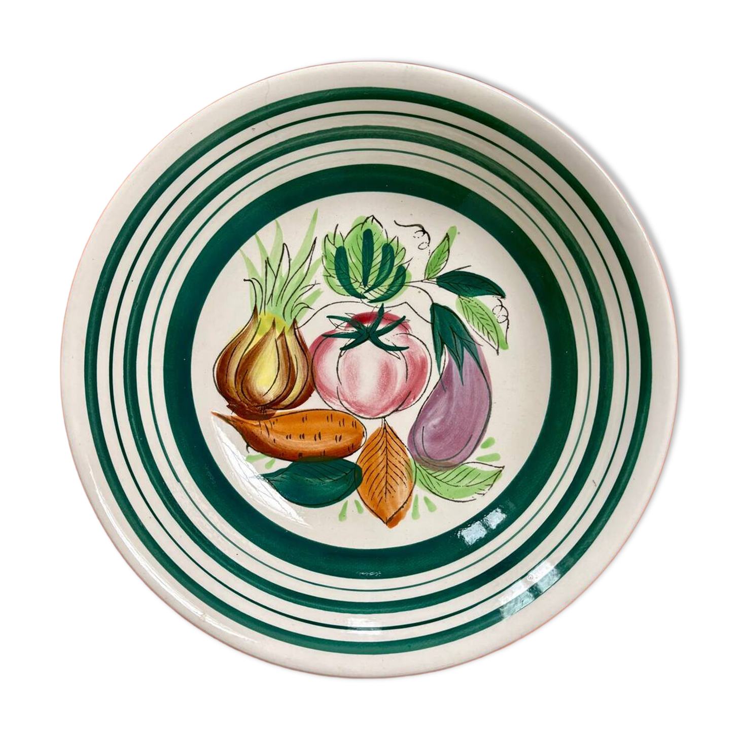 Vintage deep plate with vegetable decoration.