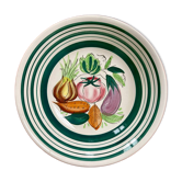 Vintage deep plate with vegetable decoration.