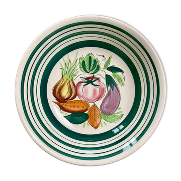 Vintage deep plate with vegetable decoration.