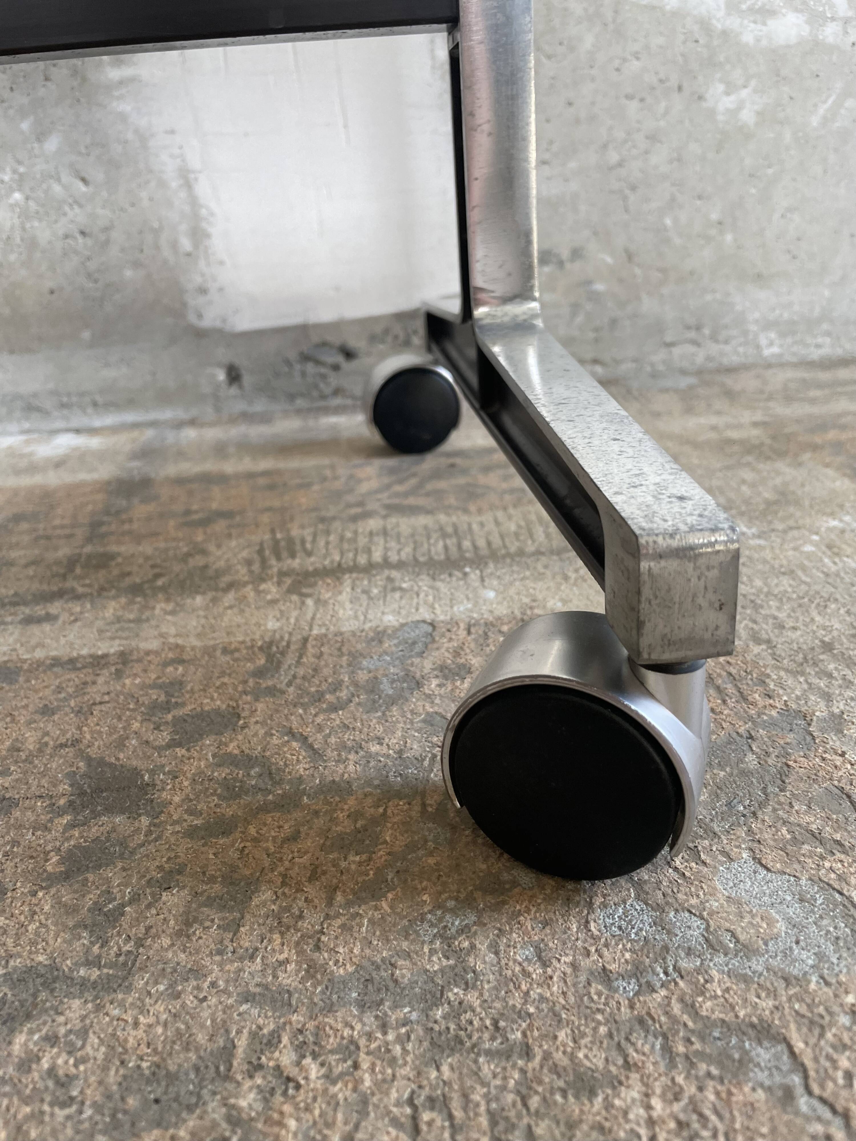 Wooden side table with chrome frame on wheels