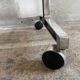 Wooden side table with chrome frame on wheels
