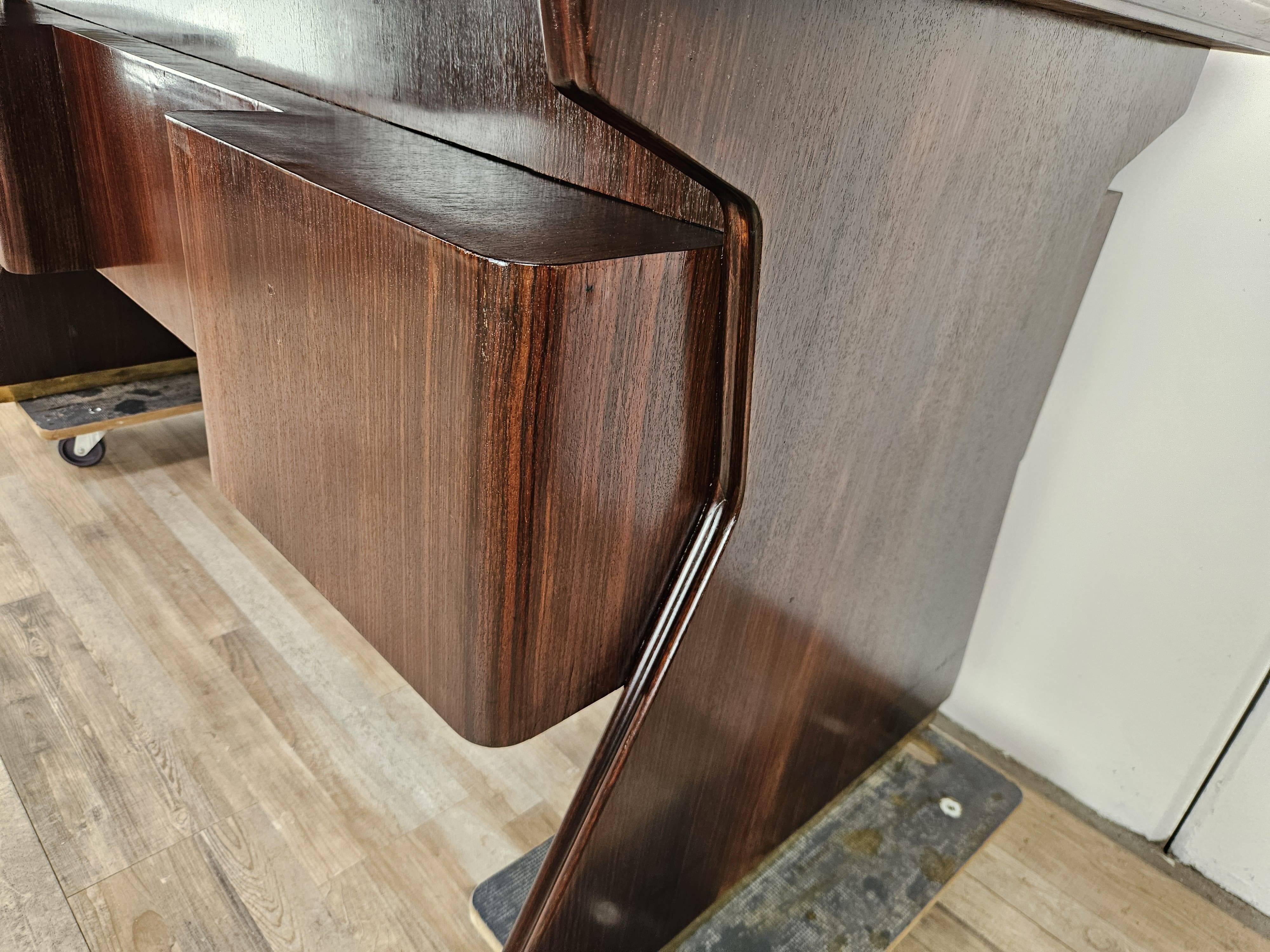 Executive Art Decò desk in exotic wood, glass, and brass