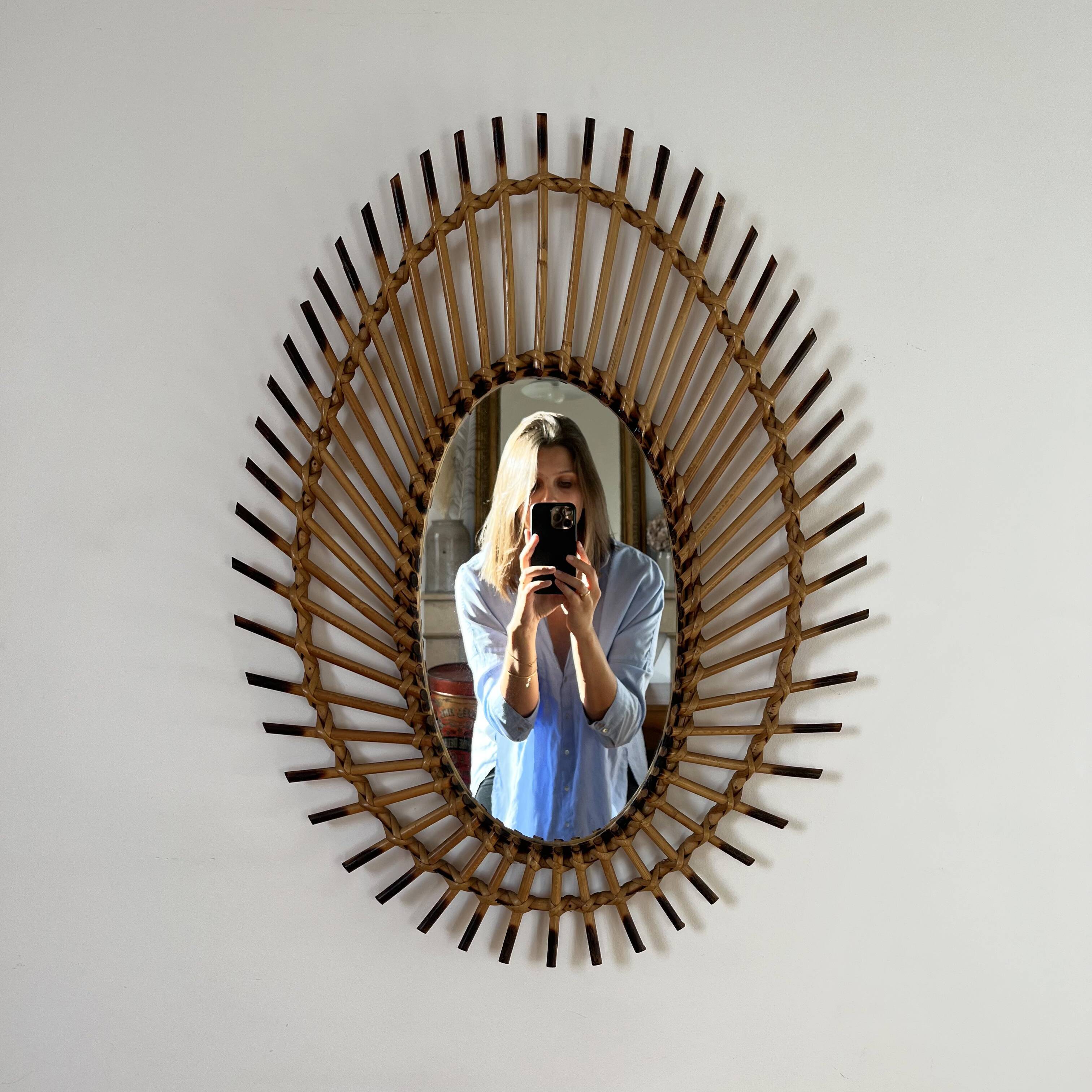 Rattan mirror in the shape of an eye