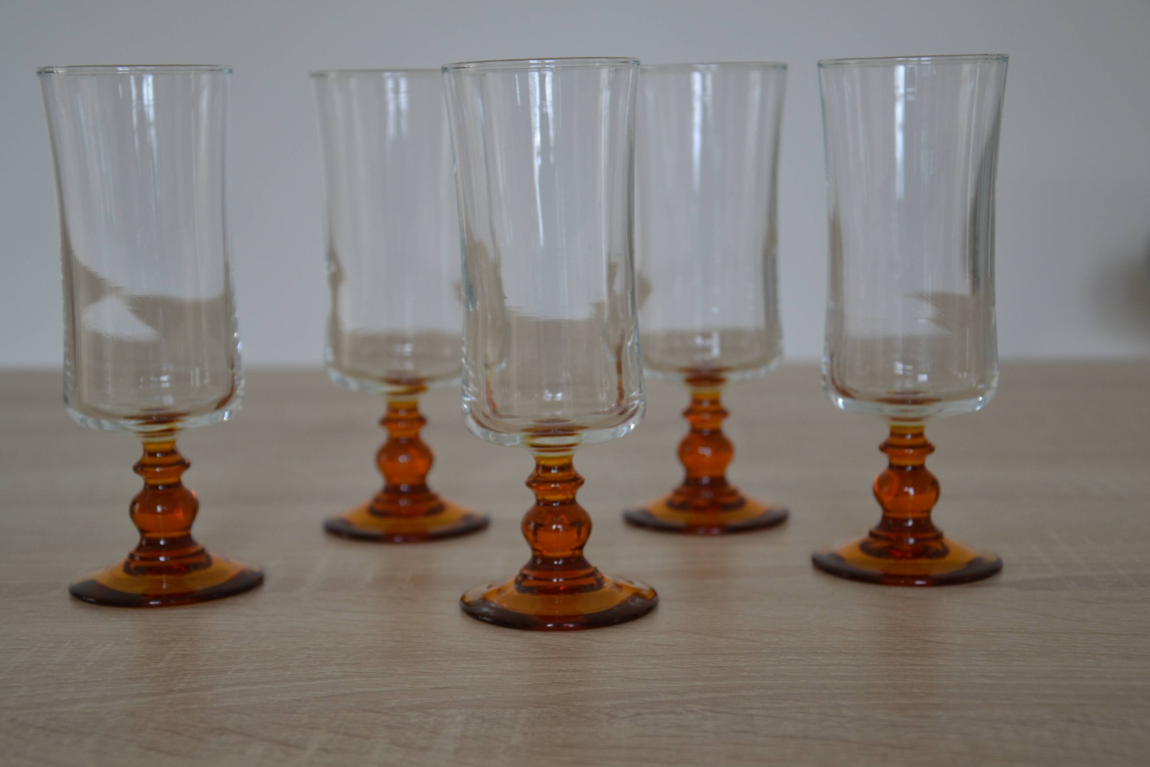 Champagne glasses with amber stems