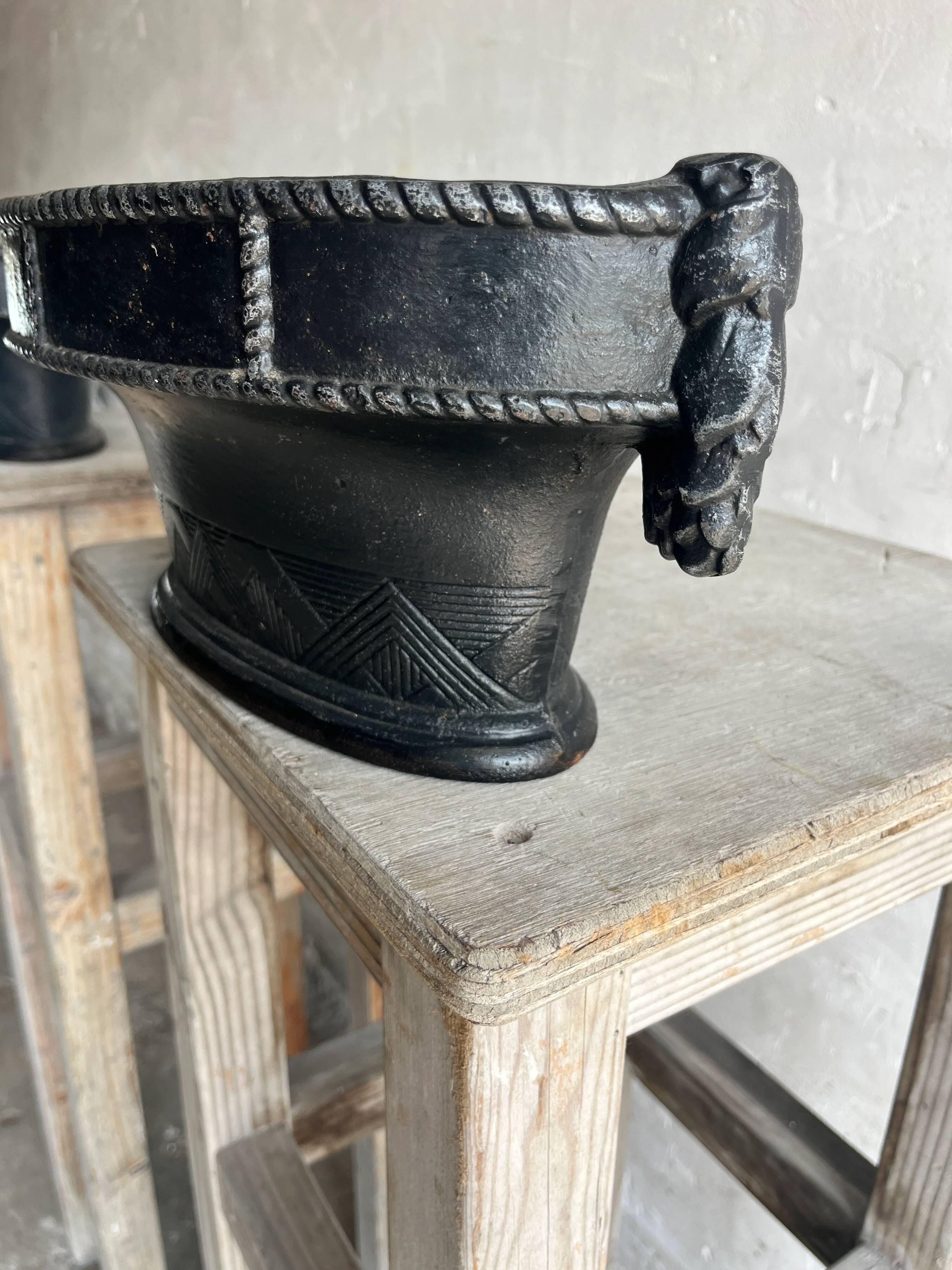 Pair of antique cast iron planters