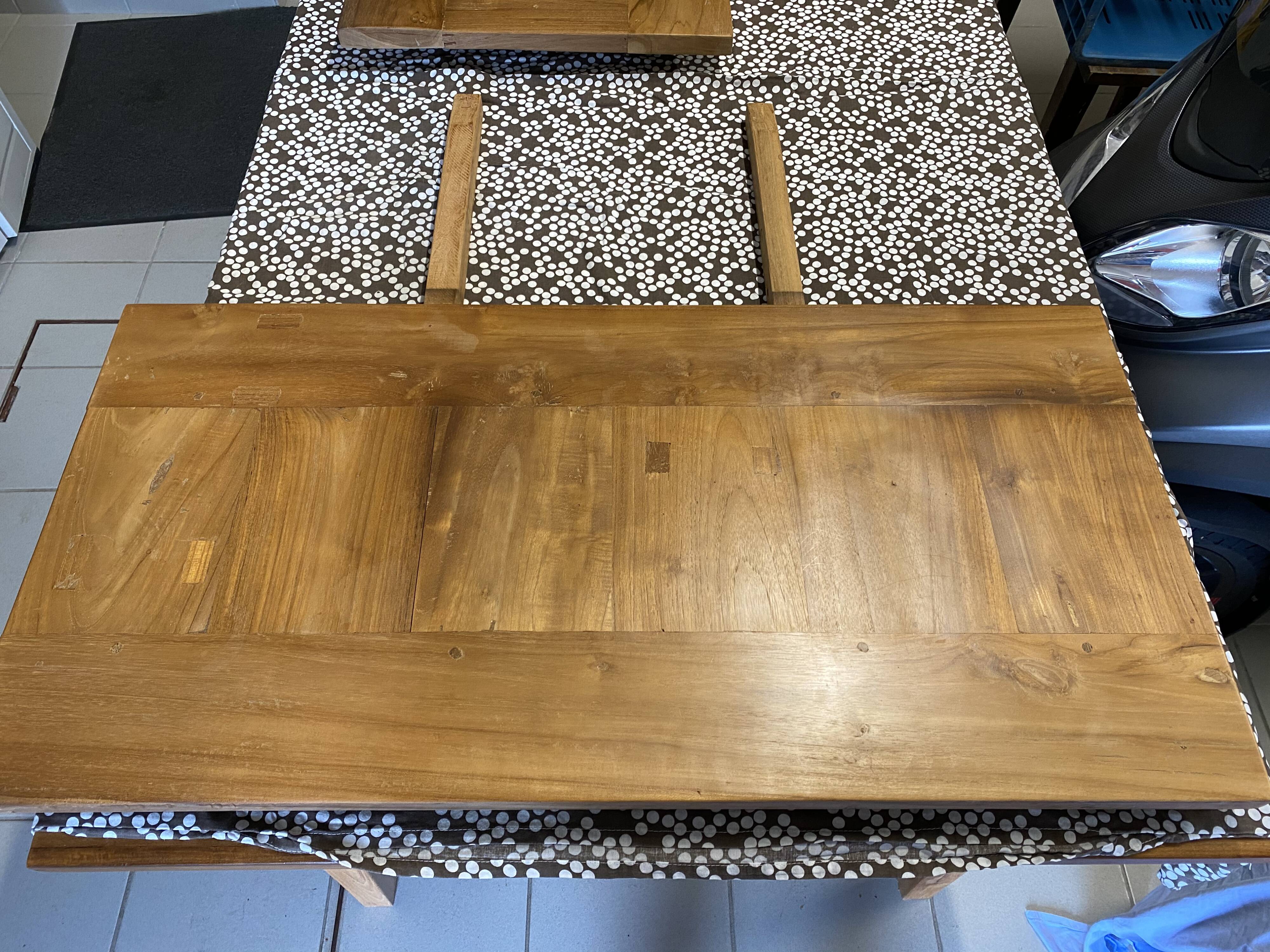 Teak table with extension cords