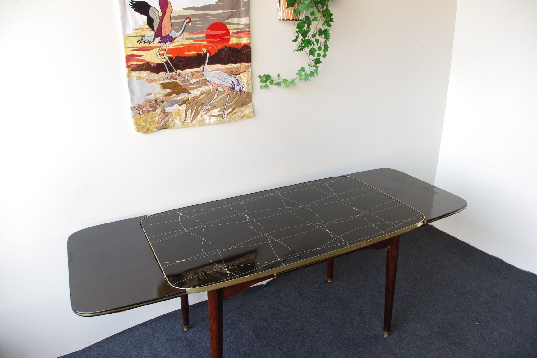 Folding table with black and gold painted glass, 1950